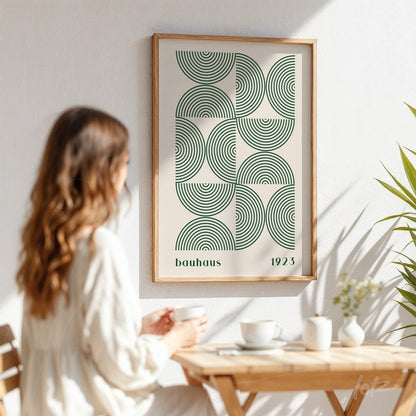poster print featuring a modern illustration of green concentric circles in a light wood frame on a white wall