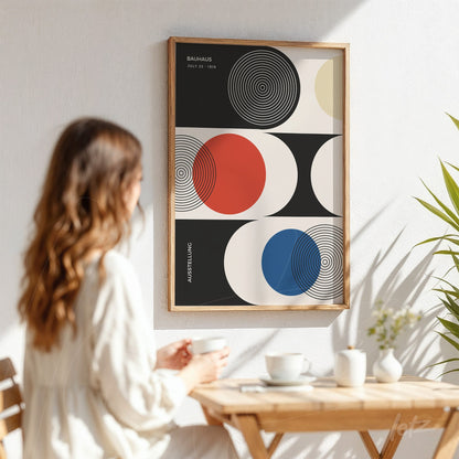 geometric colorful wall art in light wood frame displayed on white wall