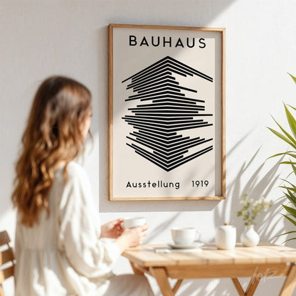 bauhaus style poster in light wood frame on white wall