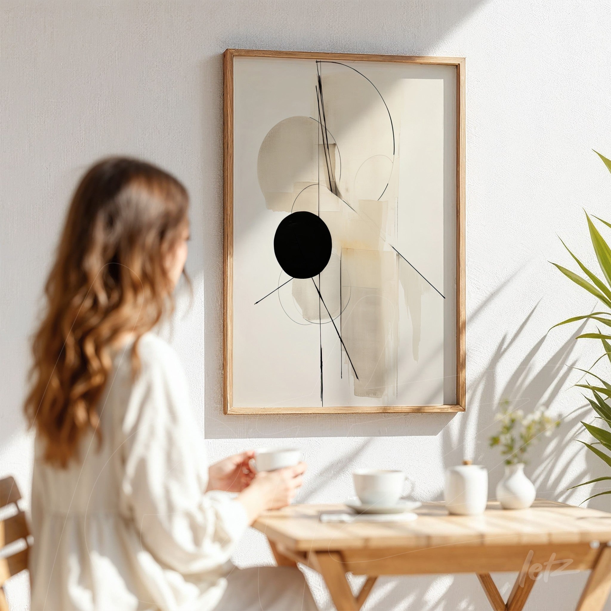 abstract art with geometric shapes in light wooden frame displayed on white wall