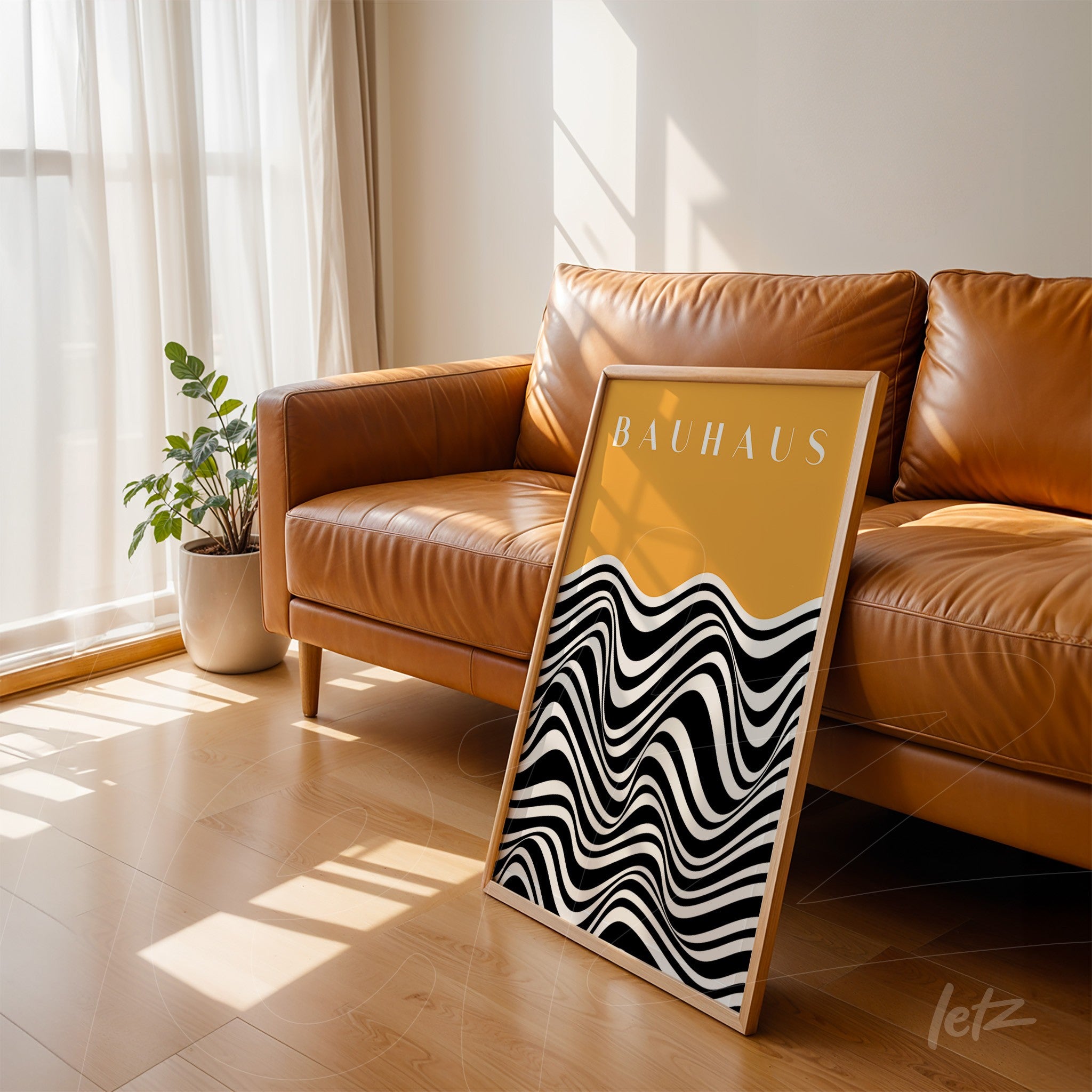 light wood frame with bauhaus geometric art poster featuring black and white wave pattern on a yellow background, leaning on caramel leather sofa