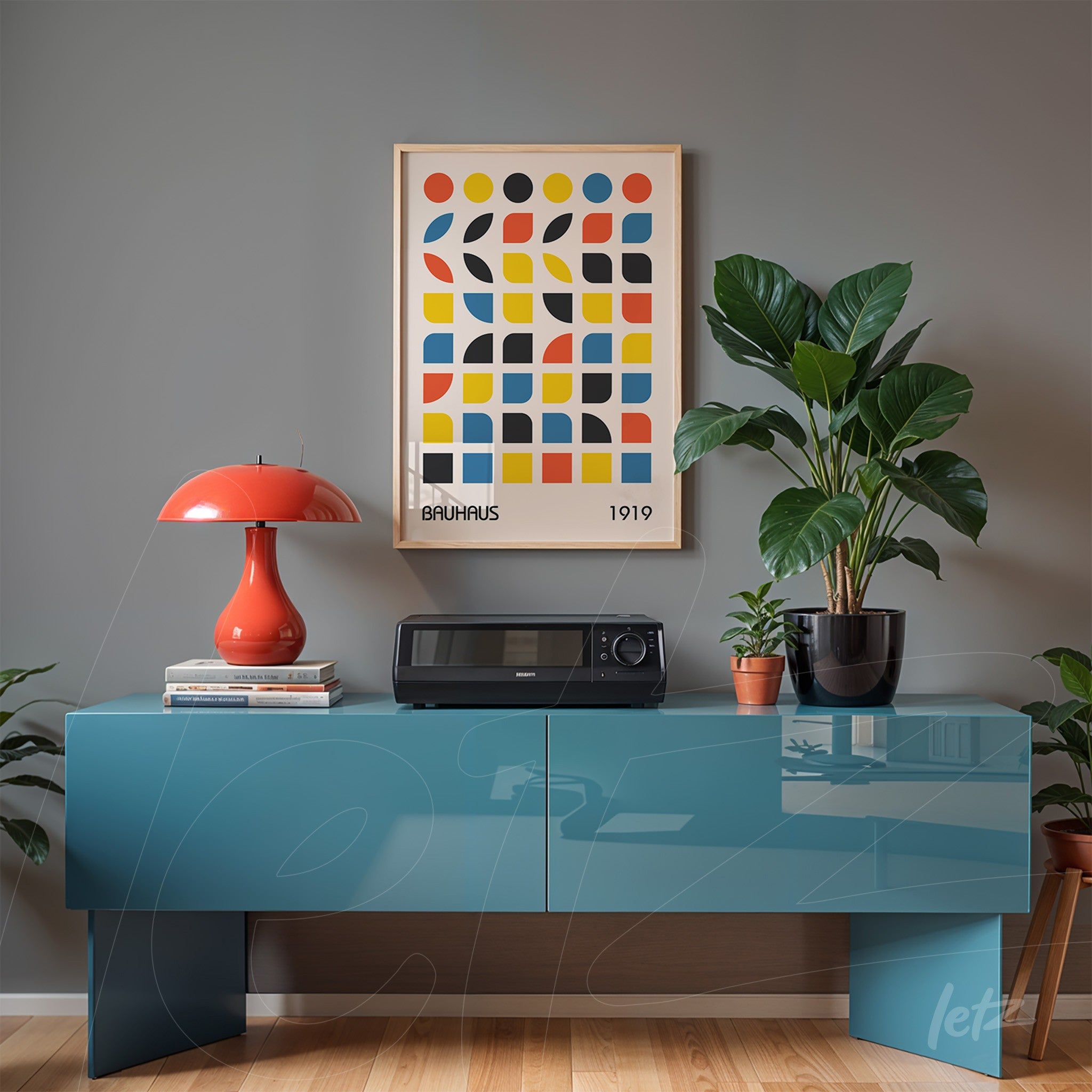 poster featuring bauhaus style geometric art with light frame hanging on gray wall above blue sideboard