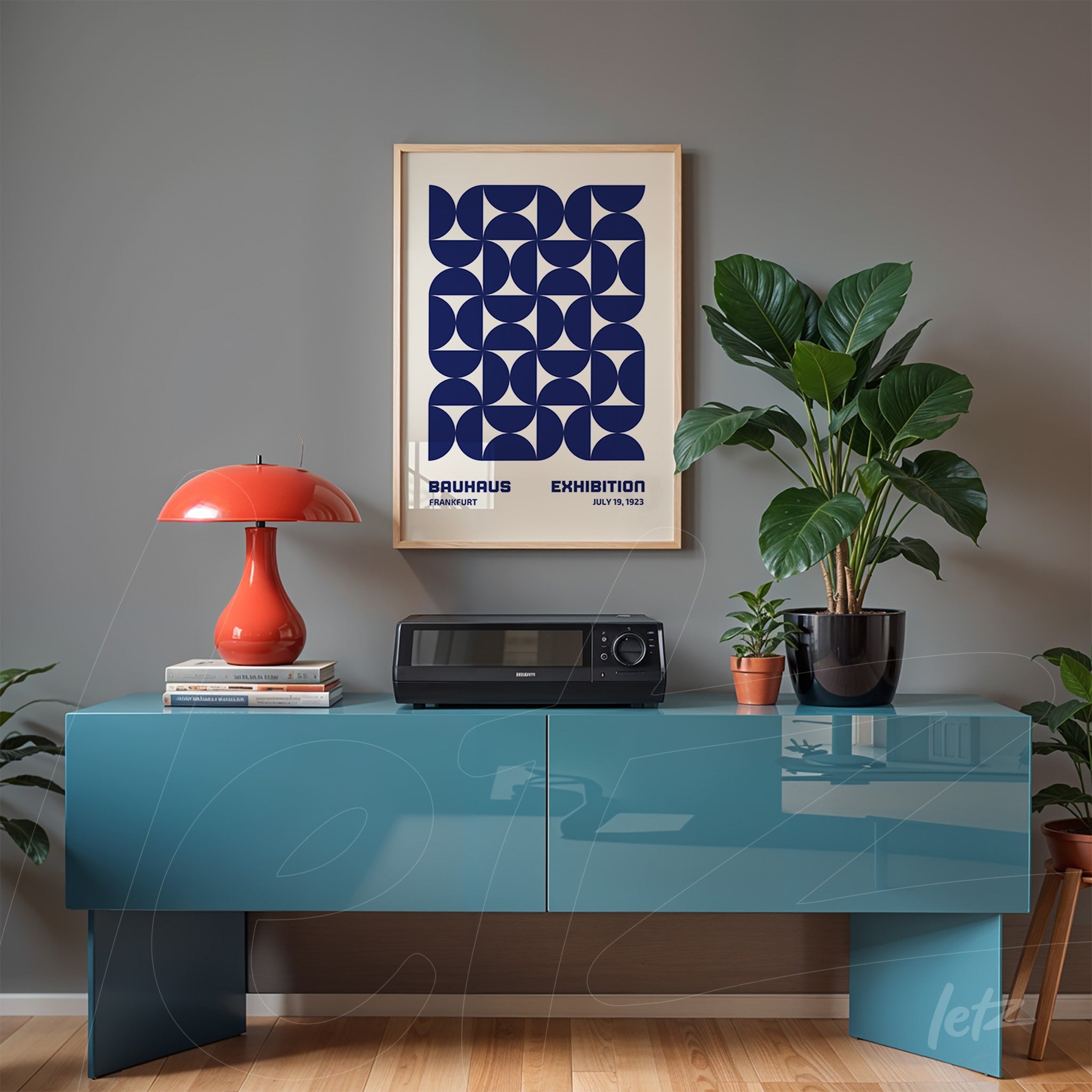framed wall art with blue Bauhaus-inspired geometric design in light wood frame displayed above a blue console table