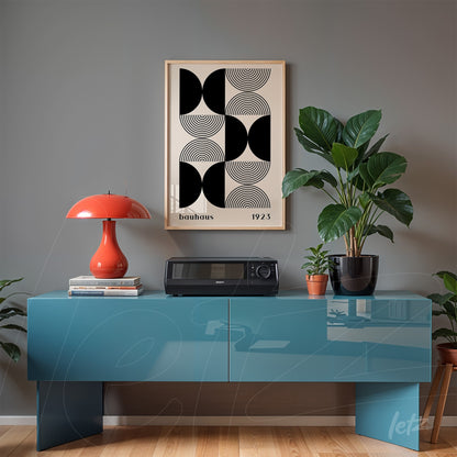 poster print featuring bauhaus style geometric art in a wooden frame displayed on a gray wall