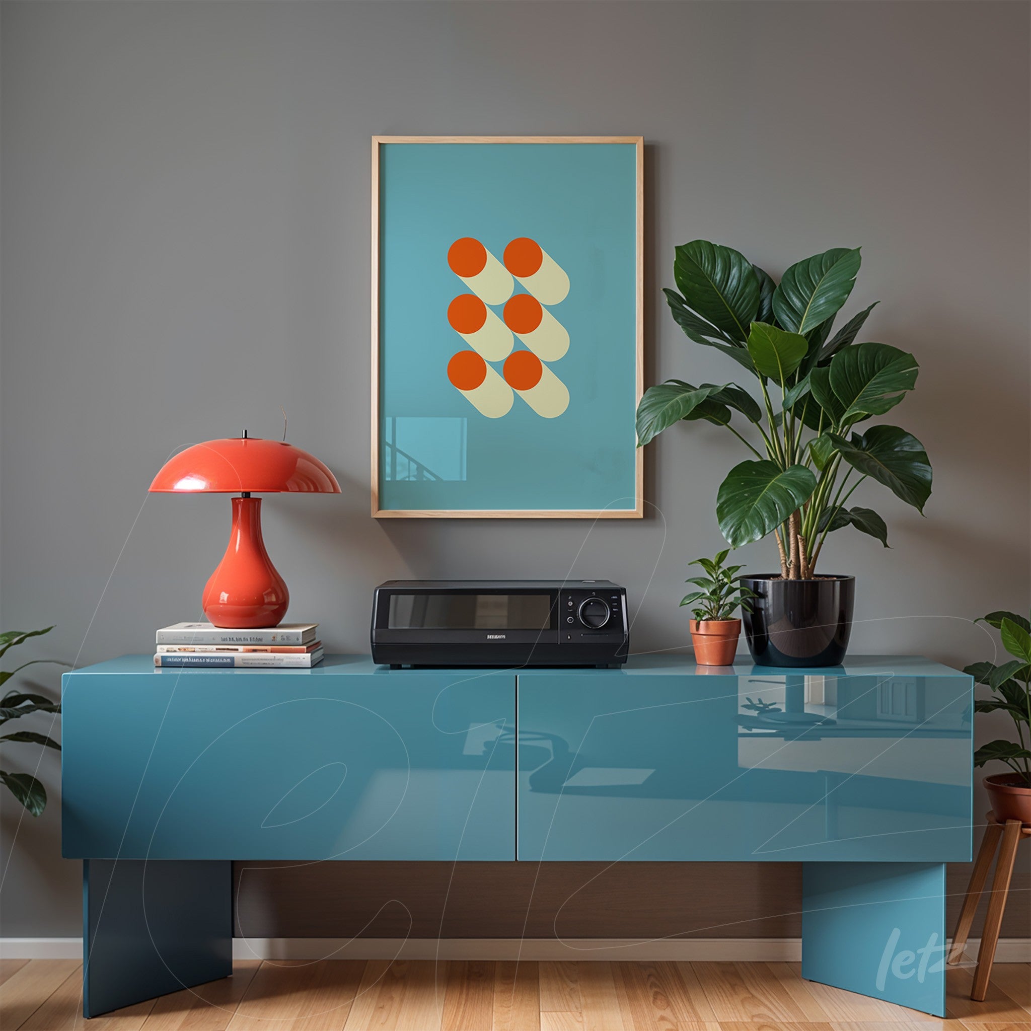 minimalist poster with red circles and shadows on a light blue background, in a light frame, hanging above a blue sideboard with a plant and red lamp
