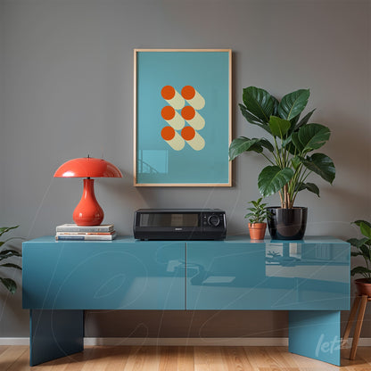 minimalist poster with red circles and shadows on a light blue background, in a light frame, hanging above a blue sideboard with a plant and red lamp
