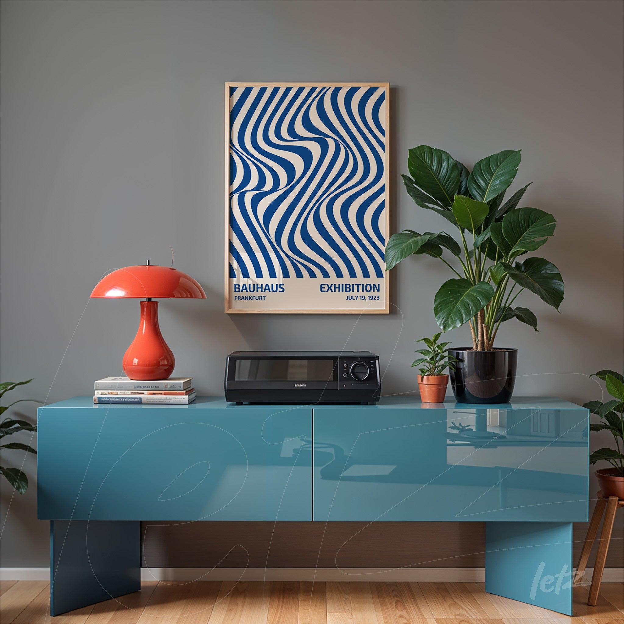 poster featuring blue wavy lines on a beige background, framed in light wood, displayed above a blue sideboard in a decorated setting