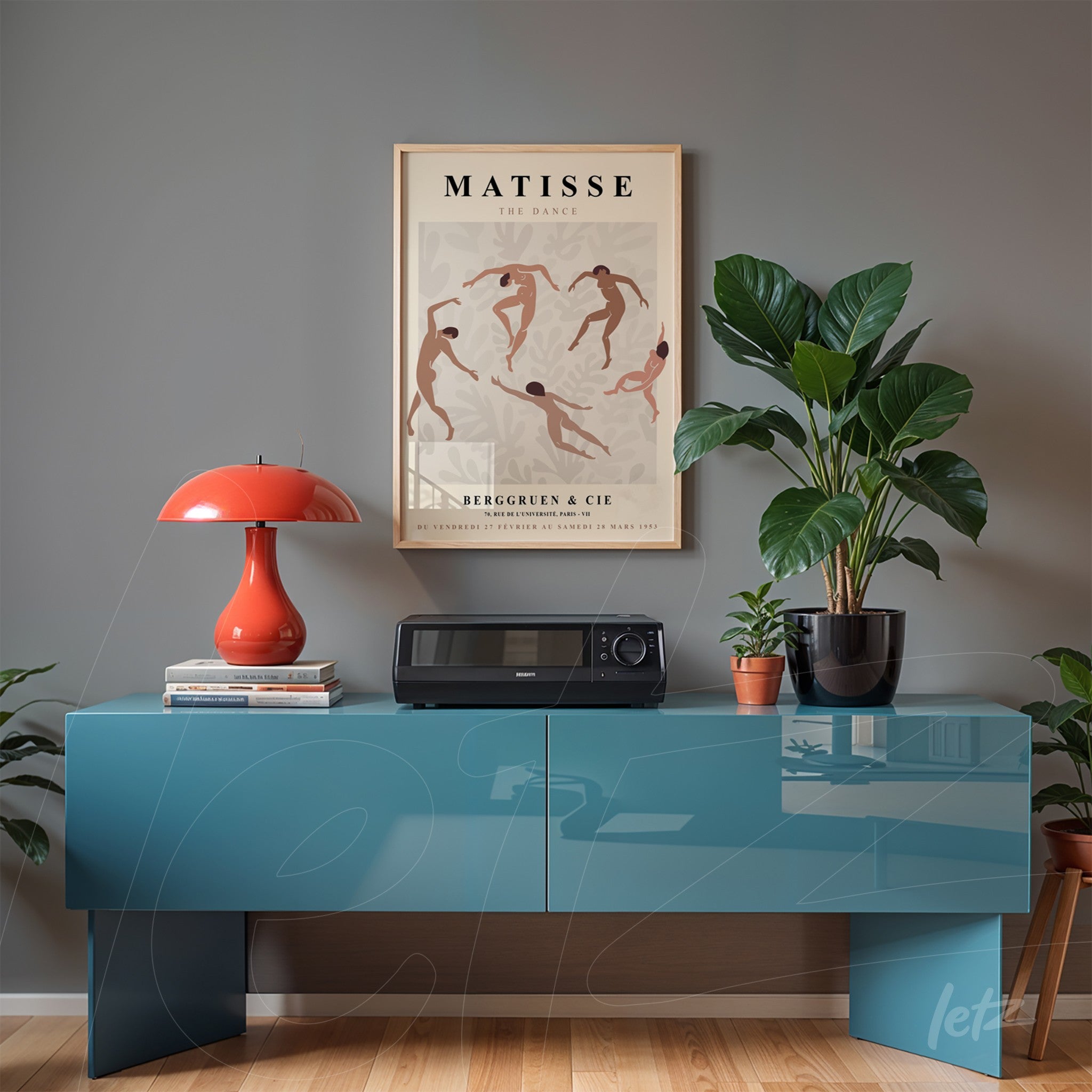decorative art print of Henri Matisse's 'The Dance' in light frame above modern blue sideboard
