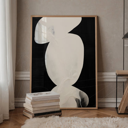 framed wall art with abstract design in shades of white on black background, displayed in a setting with wooden shelf