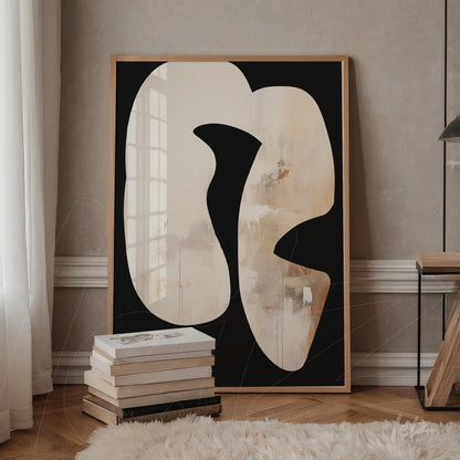 decorative artwork featuring abstract white and beige shapes on a black background in a light wood frame