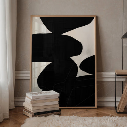 modern wall art in light wood frame featuring abstract black and white shapes on textured background