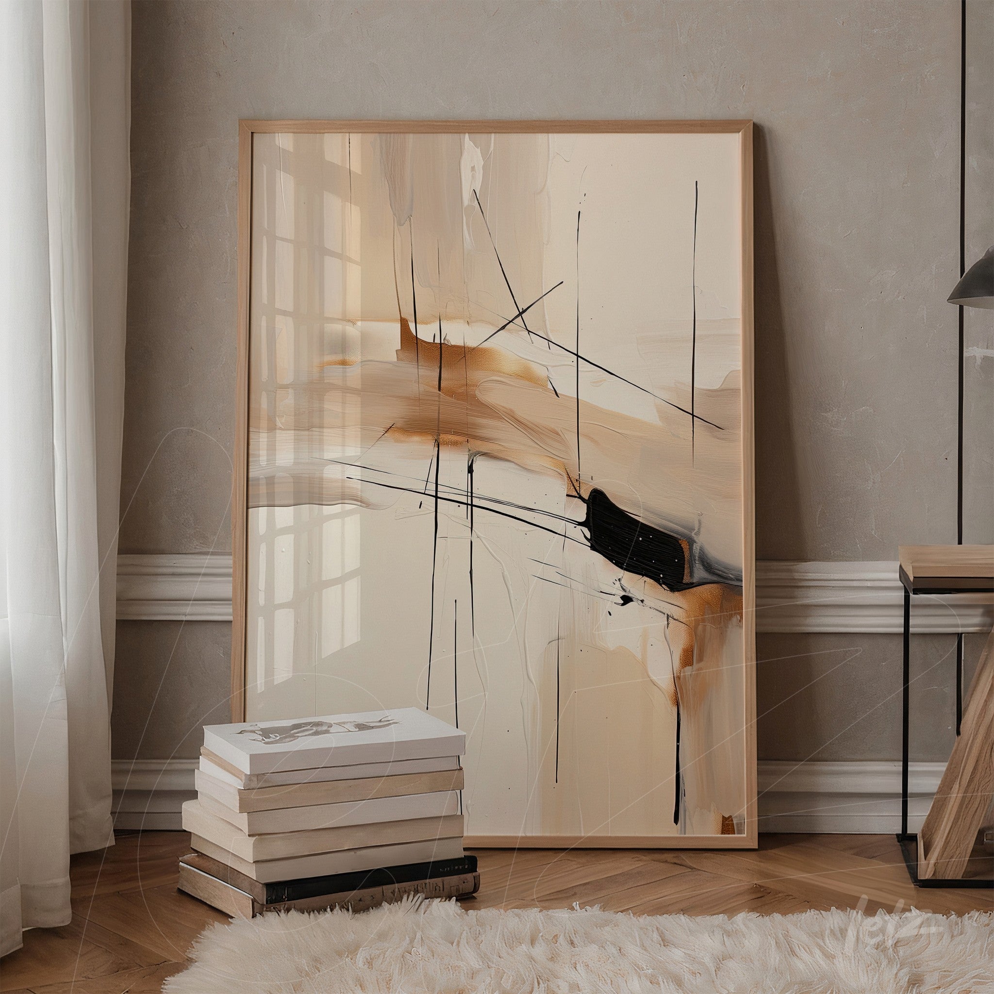 framed abstract art with earthy tones and black lines on light background leaning against the wall corner