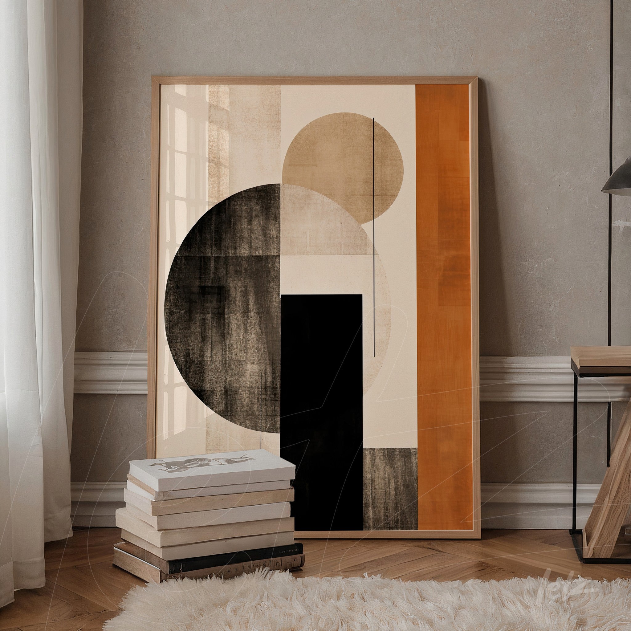 framed abstract artwork featuring earthy tones and geometric shapes displayed against a light gray wall