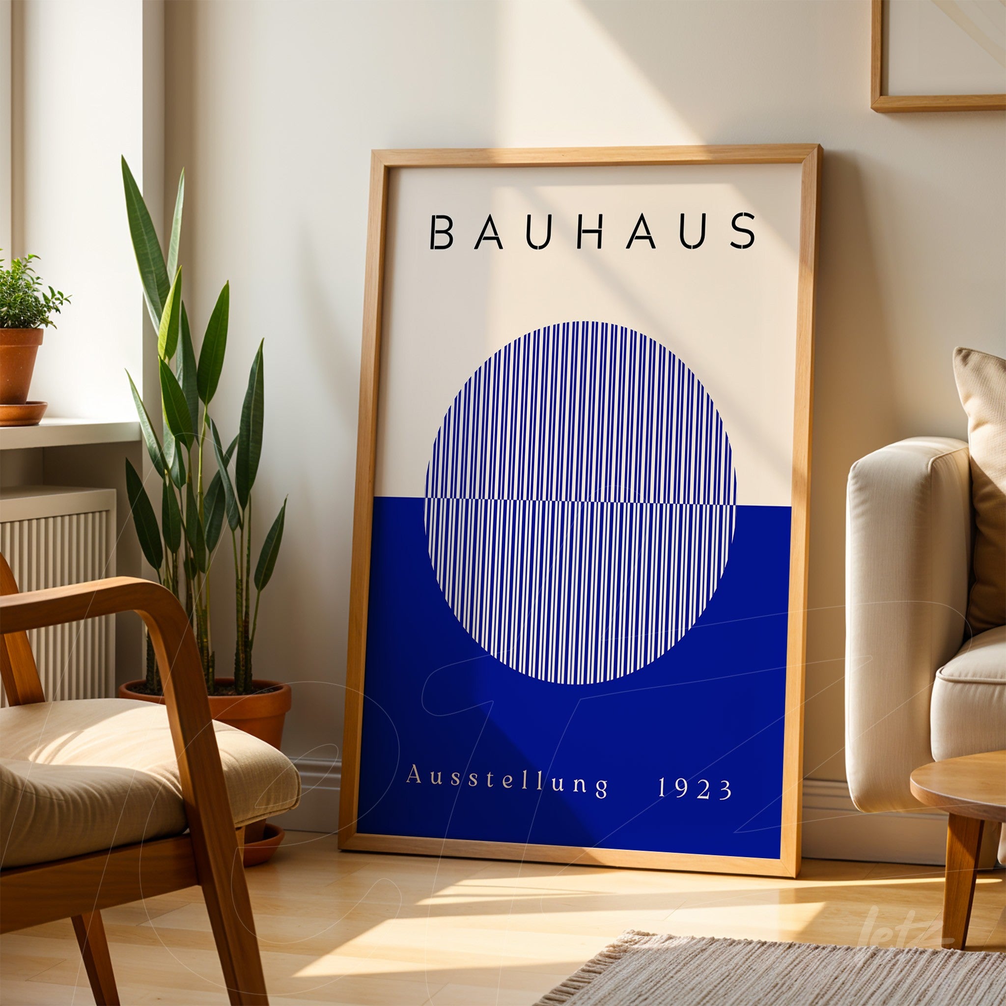 bauhaus style poster print featuring a blue circle in a light wood frame, resting on wooden floor next to cream sofa
