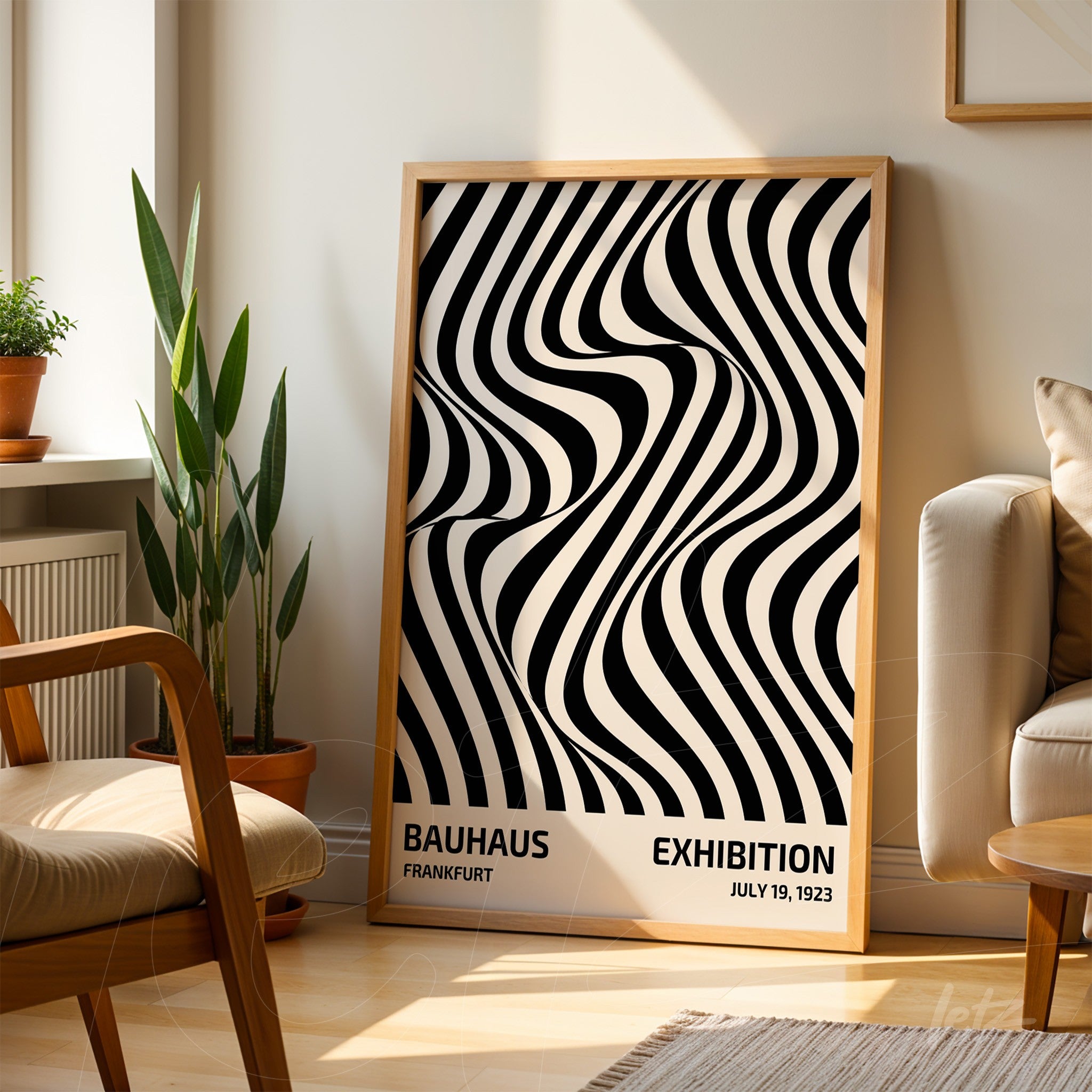 poster print with black and white wave pattern in light wood frame leaning on a sunny living room floor