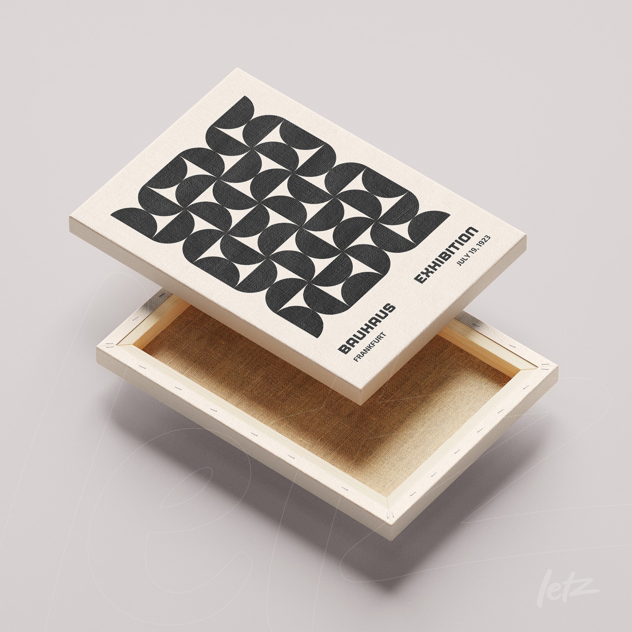 canvas print with black and white geometric art displayed on a light natural frame