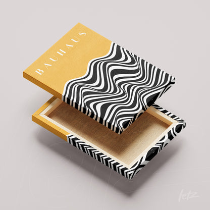 canvas print featuring black and white psychedelic waves on a yellow background with the word 'BAUHAUS' in white, displayed without a frame