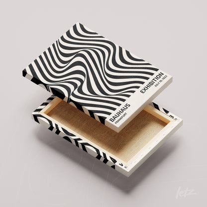 premium box with black and white Bauhaus style print, side text indicating exhibition