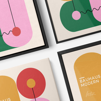 four decorative art prints featuring modern geometric designs with circular shapes and dynamic lines in black frames shown in a diagonal layout