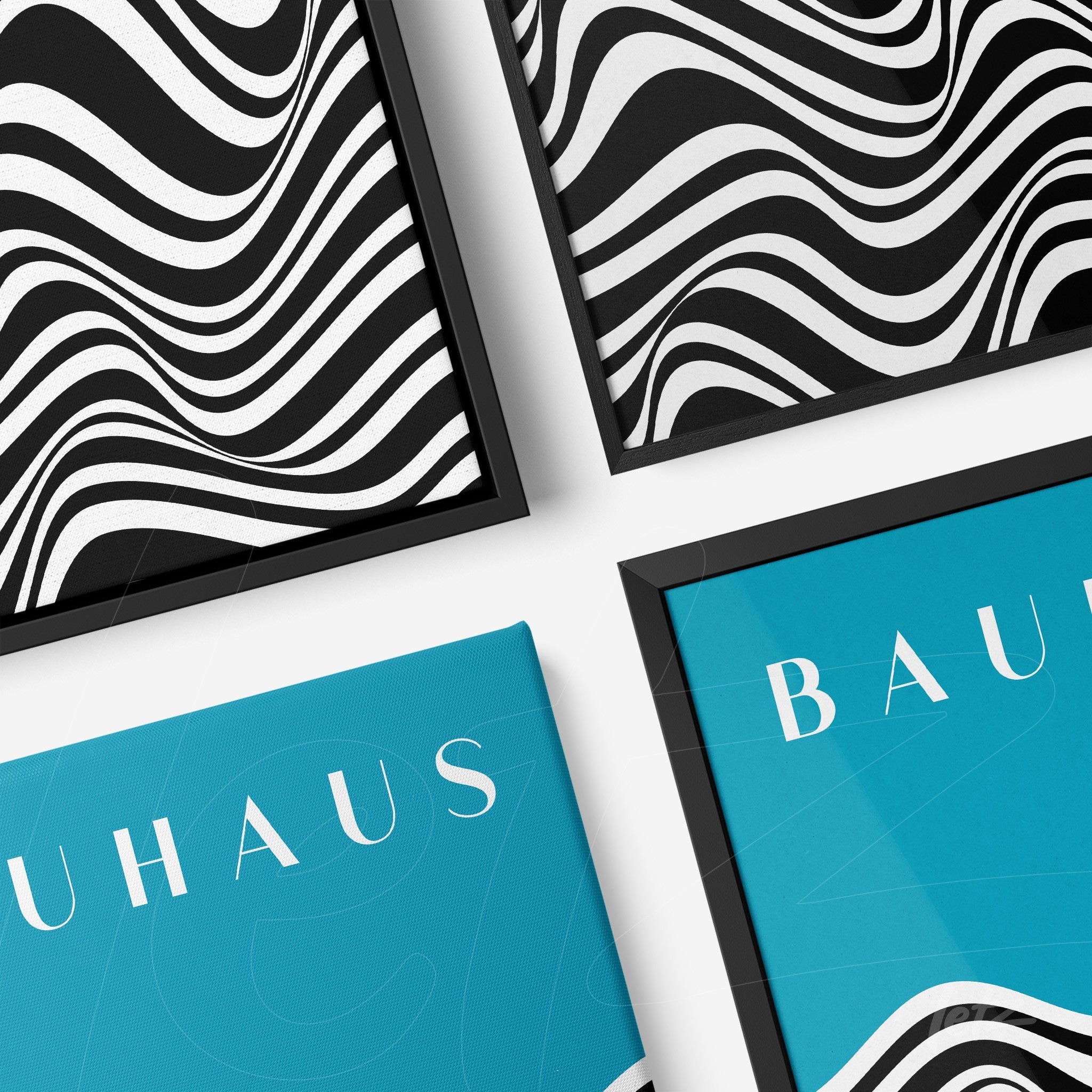 composition of four framed abstract geometric artworks with black frames on white wall