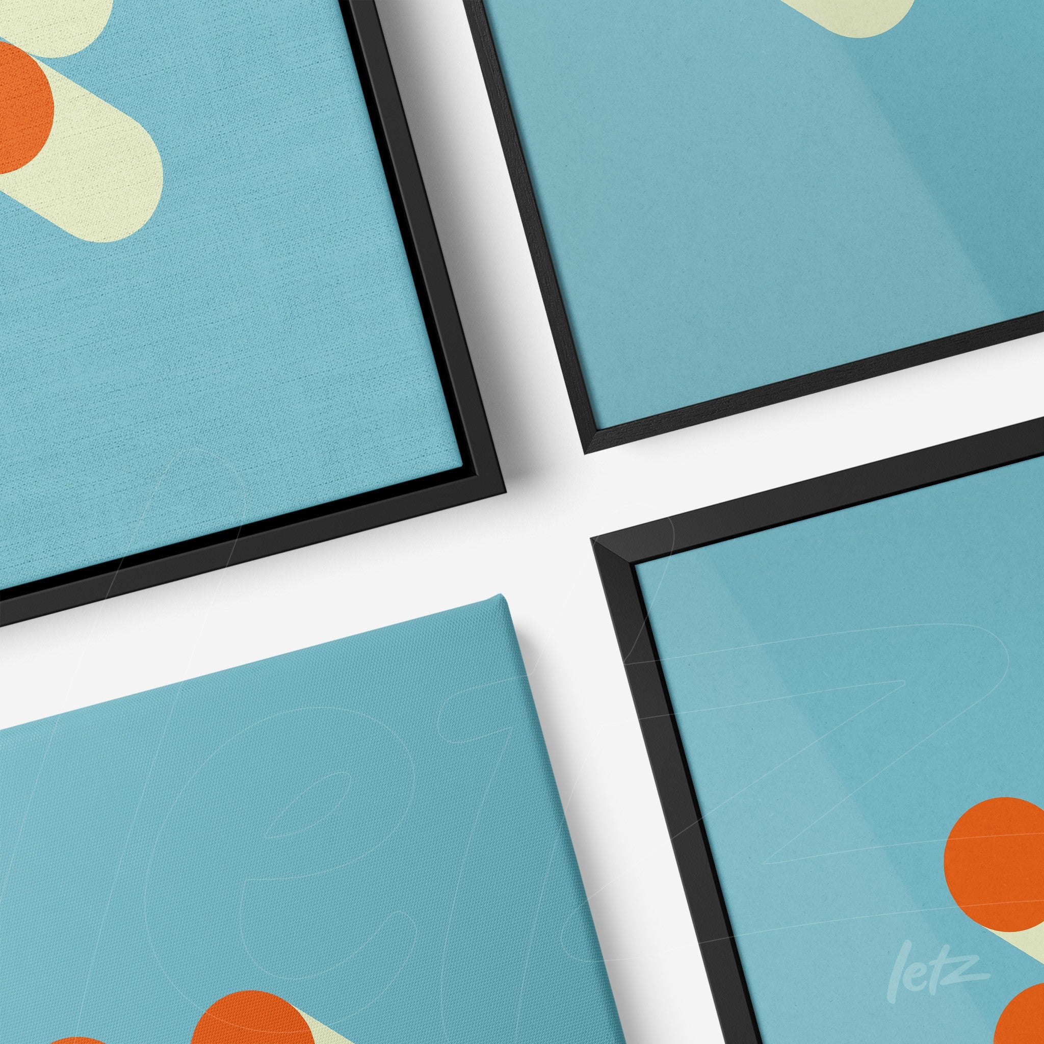 four abstract art pieces featuring blue tones and geometric shapes, showcased with black frames on a white surface