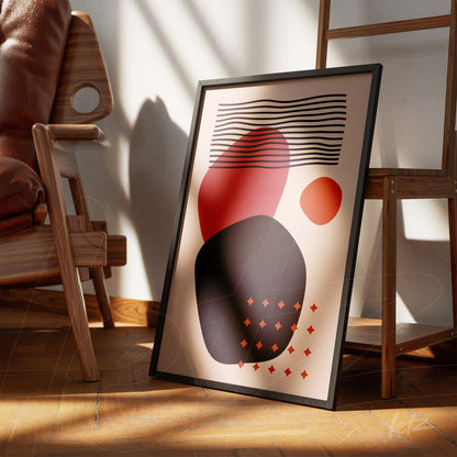 abstract geometric illustration in a black frame, leaning on a wooden floor