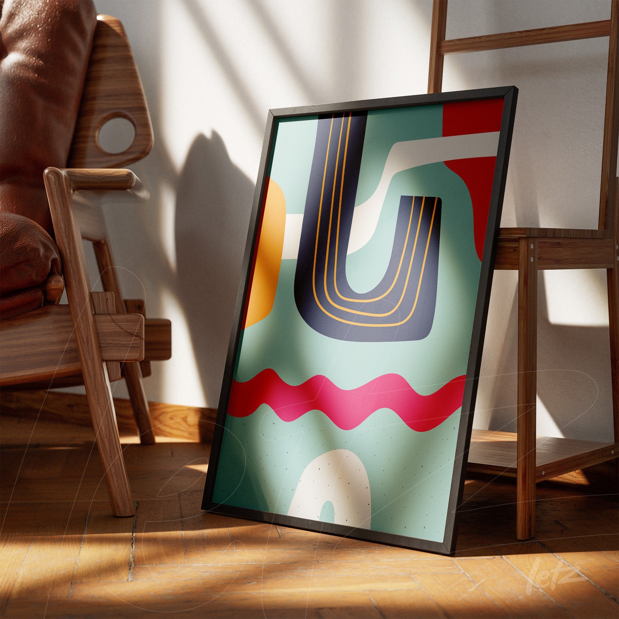 ```json
{
  "alt": "arte moderna boho com formas geométricas coloridas em moldura preta inclinada contra cadeira de madeira",
  "alt_en": "modern boho art with colorful geometric shapes in a black frame leaning against a wooden chair"
}
```