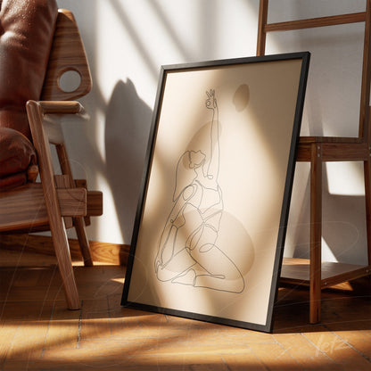 minimalist single line art of a woman in a yoga pose, displayed in a black frame on wooden floor with chair and white wall in the background