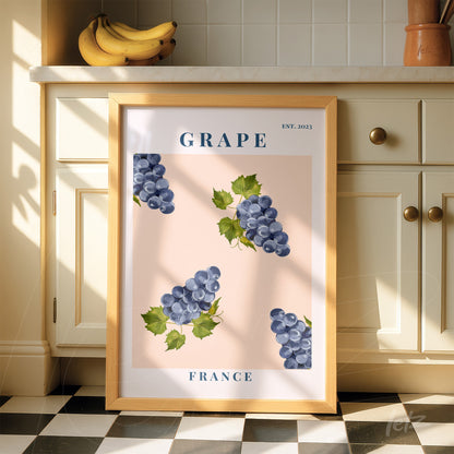 framed illustration of grapes on light pink background with light wood frame