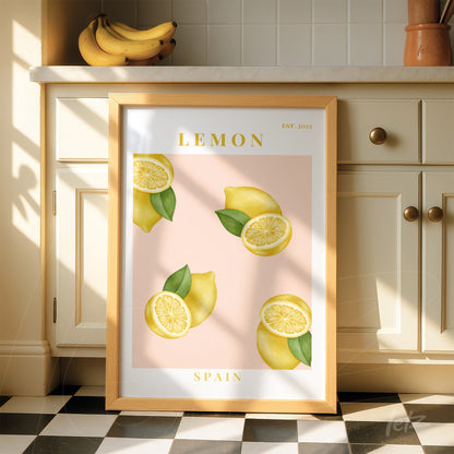 framed wall art featuring illustrations of lemons on a pink background with light wood frame