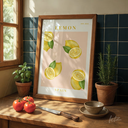 framed art of lemons on pink background, light wood frame, displayed on wooden table with red tomatoes and potted plants