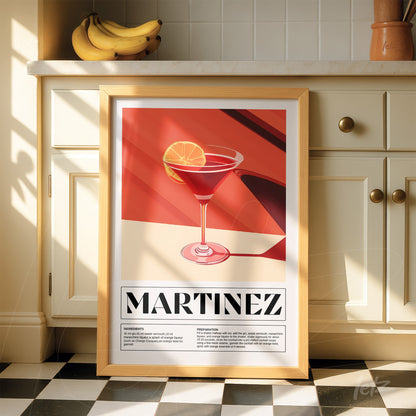 framed wall art featuring a martini drink illustration with a light wood frame, red background, and drink details
