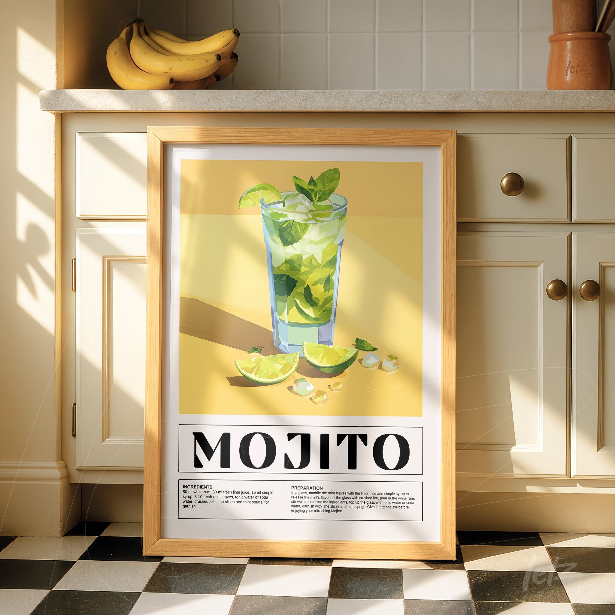 framed digital art of mojito cocktail with light wood frame displayed next to bananas on kitchen countertop