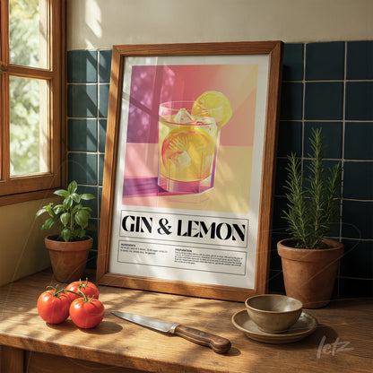 framed contemporary art featuring gin and lemon cocktail displayed on wooden table alongside tomatoes and herbs in pots