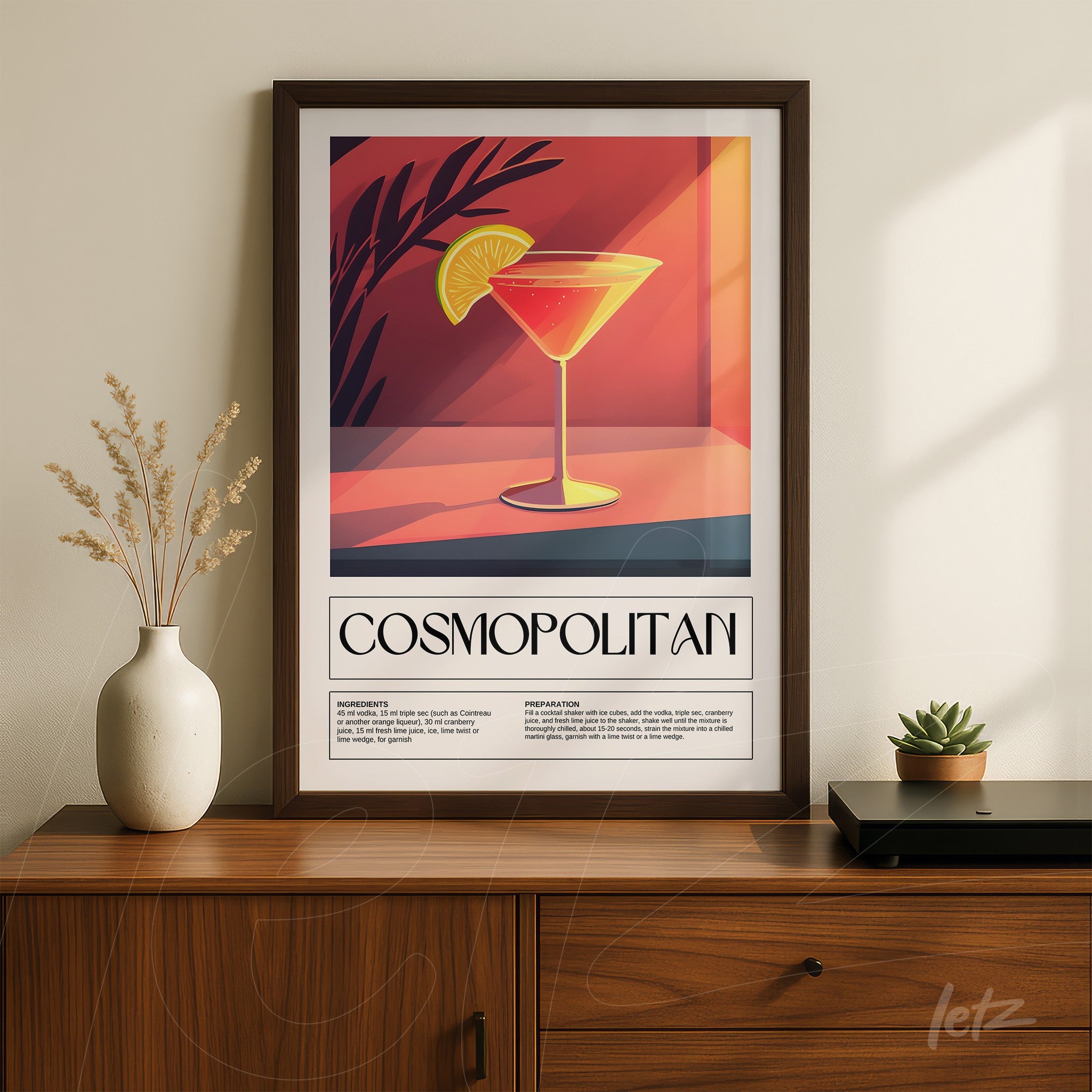 framed wall art featuring a cosmopolitan cocktail with a dark frame, set against a gradient orange background with leaf details