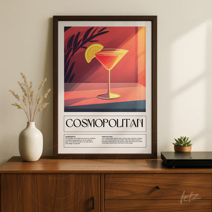 framed wall art featuring a cosmopolitan cocktail with a dark frame, set against a gradient orange background with leaf details