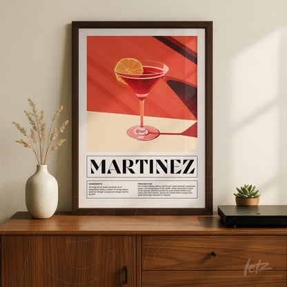 framed artwork of a stylized martinez cocktail in dark frame on a wooden surface