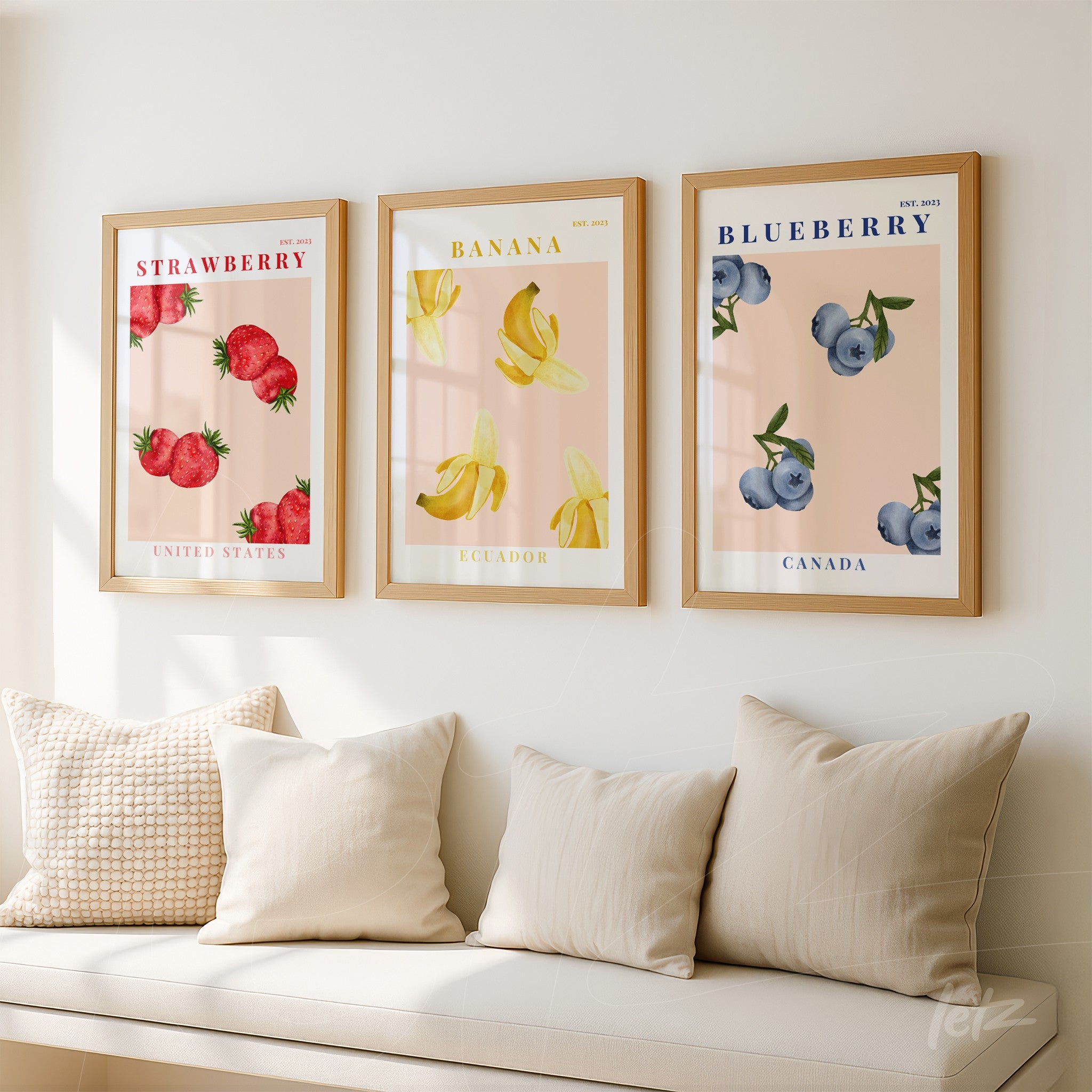 collection of three framed artworks featuring illustrations of strawberries, bananas, and blueberries on a soft background