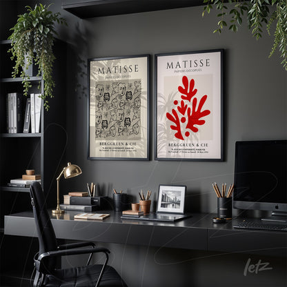 composition of two framed artworks by Matisse on gray wall showcasing abstract shapes and black and red strokes