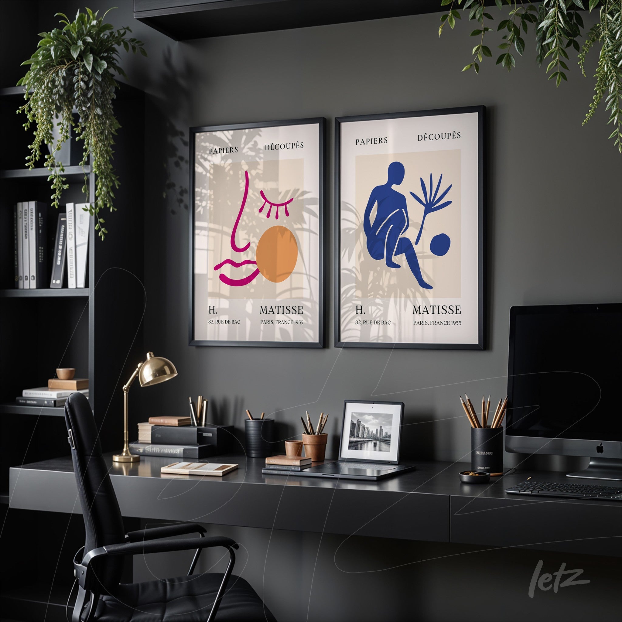 composition of two framed modern artworks with black frames featuring stylized illustrations of a face and a seated figure against a dark gray wall