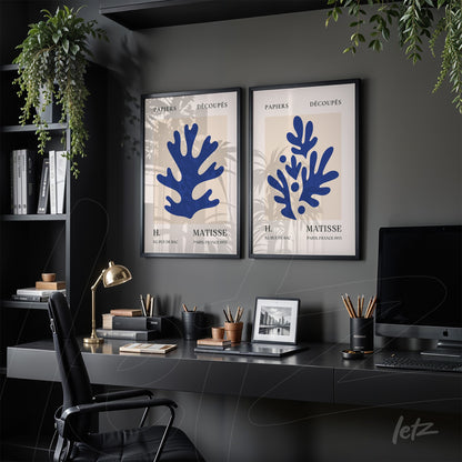 composition of framed artwork featuring abstract seaweed shapes in black frame on light background in a modern office setting