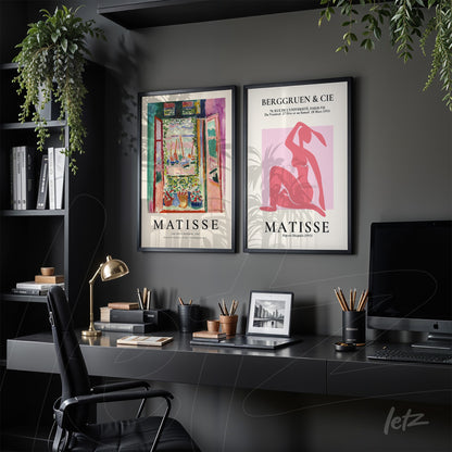 framed wall art featuring works by Matisse in black frames in a modern office setting
