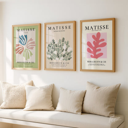 composition of three framed artworks inspired by Matisse in light wood displayed on a bright wall