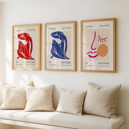 set of decorative wall art featuring Matisse's designs in light wood frames, showcasing human figures in red, blue, and facial outlines on neutral backgrounds