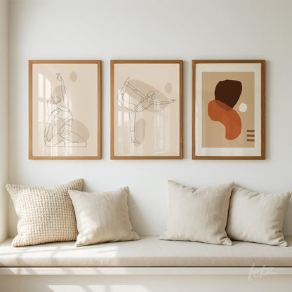 set of three framed wall art pieces featuring minimalist abstract line drawings in light wood frames, displayed above a bench with beige cushions