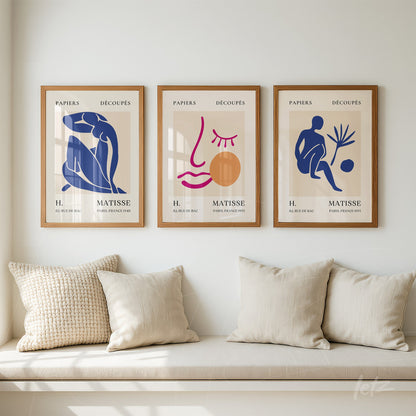 composition of three framed wall art pieces featuring stylized figures and graphic elements in shades of blue and terracotta on cream background