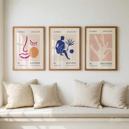 set of decorative wall art in light wood frames featuring vibrant abstract designs on a light background