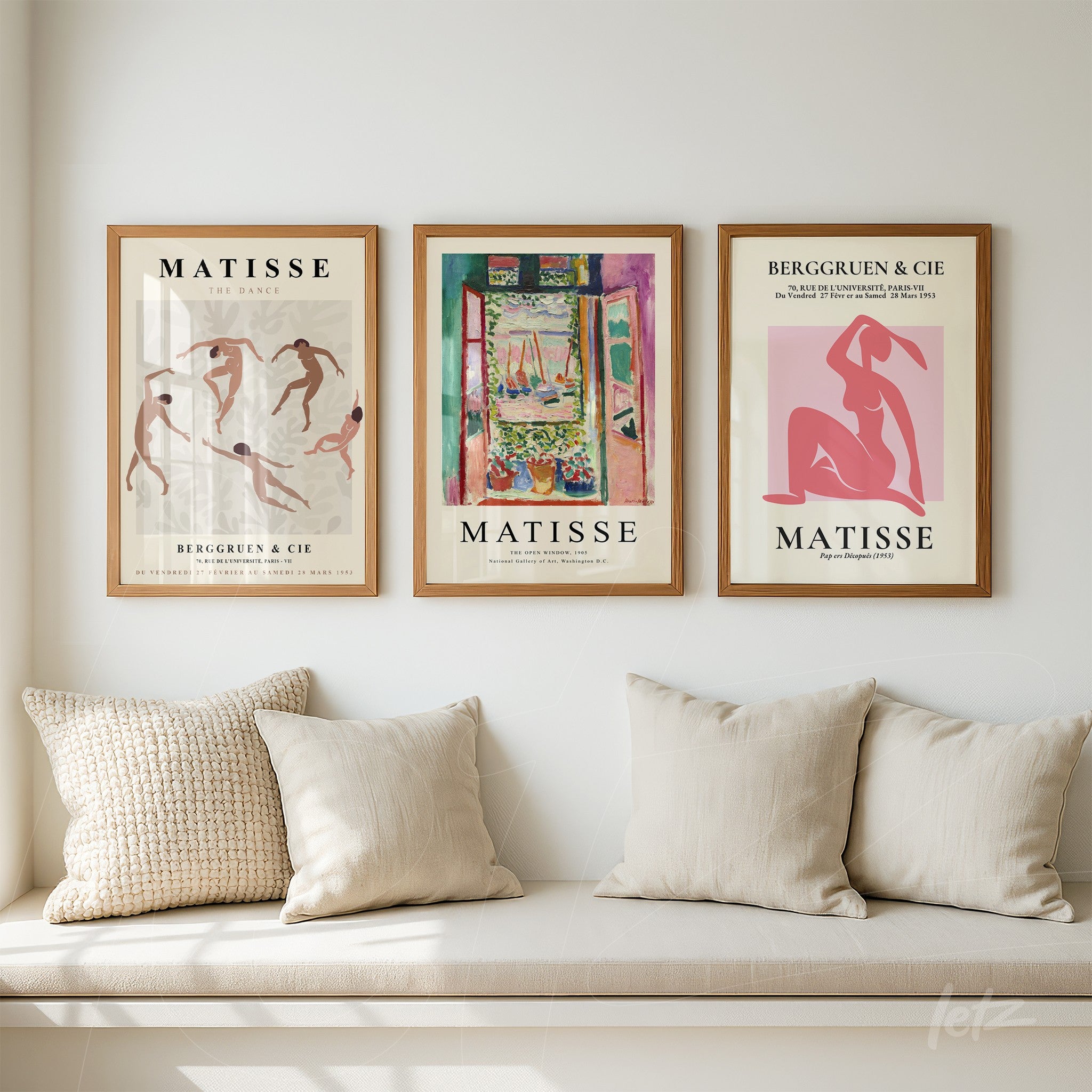 composition with three framed artworks of matisse illustrations on wall, displayed in light wooden frames