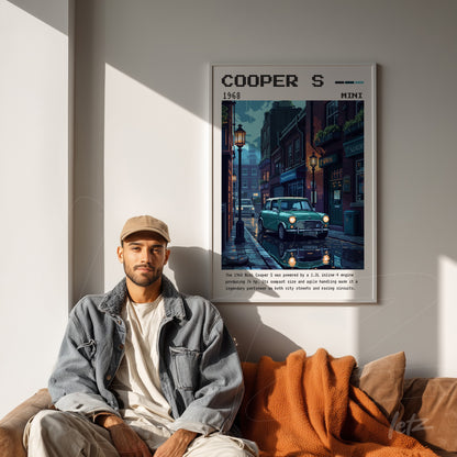 framed retro wall art of a cooper s car with white frame on light wall featuring streetlights and vintage architecture