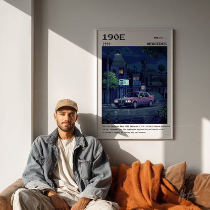 framed pixel art illustration of the Mercedes 190E displayed on a light wall beside a man wearing a cap and jacket
